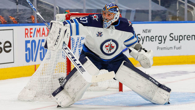 EDMONTON, AB - MAY 19: Winnipeg Jets Goalie Connor Hellebuyck (37) makes a save in the first period during First Round of the Stanley Cup Playoffs between the Edmonton Oilers versus the Winnipeg Jets on MAY 19, 2021 at Rogers Place in Edmonton, AB.
