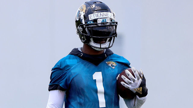 JACKSONVILLE, FLORIDA - MAY 27: Travis Etienne Jr. #1 of the Jacksonville Jaguars performs drills during Jacksonville Jaguars Training Camp at TIAA Bank Field on May 27, 2021 in Jacksonville, Florida.