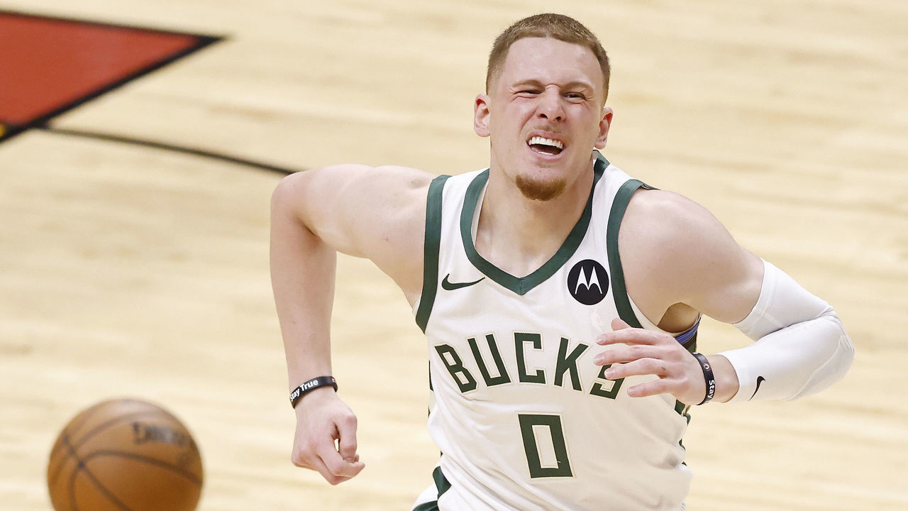 MIAMI, FLORIDA - MAY 27: Donte DiVincenzo #0 of the Milwaukee Bucks reacts after injuring his ankle against the Miami Heat during the second quarter in Game Three of the Eastern Conference first-round playoff series at American Airlines Arena on May 27, 2021 in Miami, Florida. DiVincenzo did not return to the game.