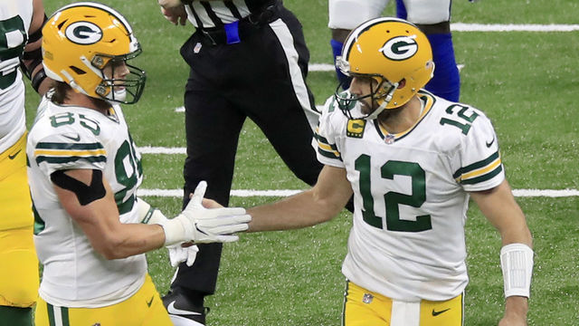 INDIANAPOLIS, INDIANA - NOVEMBER 22: Aaron Rodgers #12 of the Green Bay Packers celebrates a touchdown with Robert Tonyan #85 after the pair combined to score during the first quarter against the Indianapolis Colts in the game at Lucas Oil Stadium on November 22, 2020 in Indianapolis, Indiana.