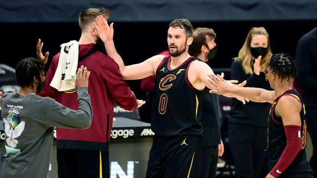 CLEVELAND, OHIO - MAY 12: Kevin Love #0 of the Cleveland Cavaliers high-fives teammates during a timeout in their game against the Boston Celtics at Rocket Mortgage Fieldhouse on May 12, 2021 in Cleveland, Ohio. The Cleveland Cavaliers won 102-94.