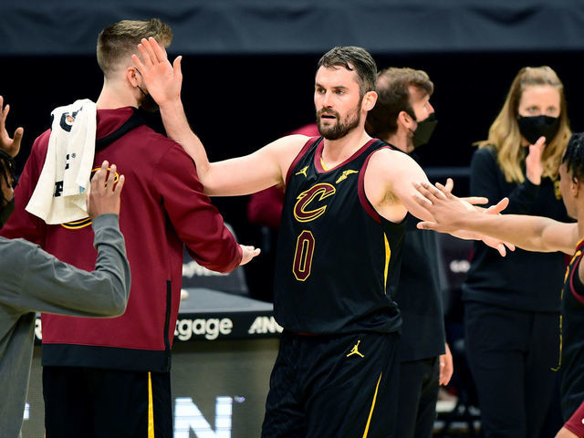 CLEVELAND, OHIO - MAY 12: Kevin Love #0 of the Cleveland Cavaliers high-fives teammates during a timeout in their game against the Boston Celtics at Rocket Mortgage Fieldhouse on May 12, 2021 in Cleveland, Ohio. The Cleveland Cavaliers won 102-94.