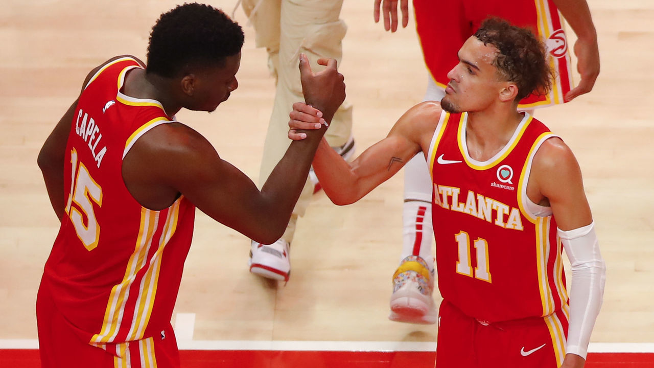 ATLANTA, GA - MAY 28: Trae Young #11 reacts with Clint Capela #15 of the Atlanta Hawks at the conclusion of the game against the New York Knicks in game three of the Eastern Conference Quarterfinals at State Farm Arena on May 28, 2021 in Atlanta, Georgia. NOTE TO USER: User expressly acknowledges and agrees that, by downloading and/or using this photograph, user is consenting to the terms and conditions of the Getty Images License Agreement.