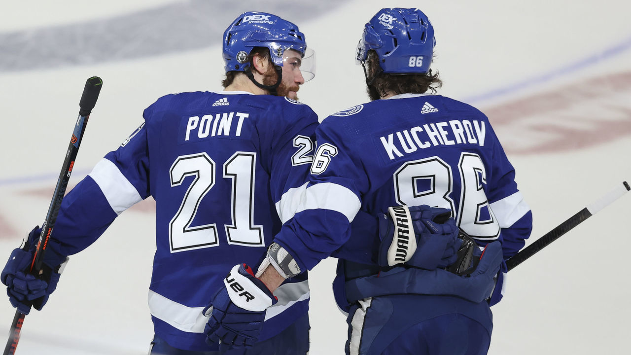 TAMPA, FL - MAY 26: Tampa Bay Lightning center Brayden Point (21) celebrates with Tampa Bay Lightning right wing Nikita Kucherov (86) after scoring a goal in the third period of Game 6 of the First Round of the NHL Play-offs between the Florida Panthers and Tampa Bay Lightning on May 26, 2021 at Amalie Arena in Tampa, FL.
