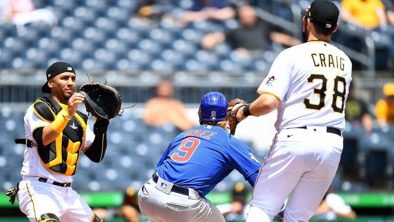 PITTSBURGH, PA - MAY 27: Javier Baez #9 of the Chicago Cubs is caught in a rundown between catches Michael Perez #5 and first baseman by Will Craig #38 of the Pittsburgh Pirates during the third inning at PNC Park on May 27, 2021 in Pittsburgh, Pennsylvania.