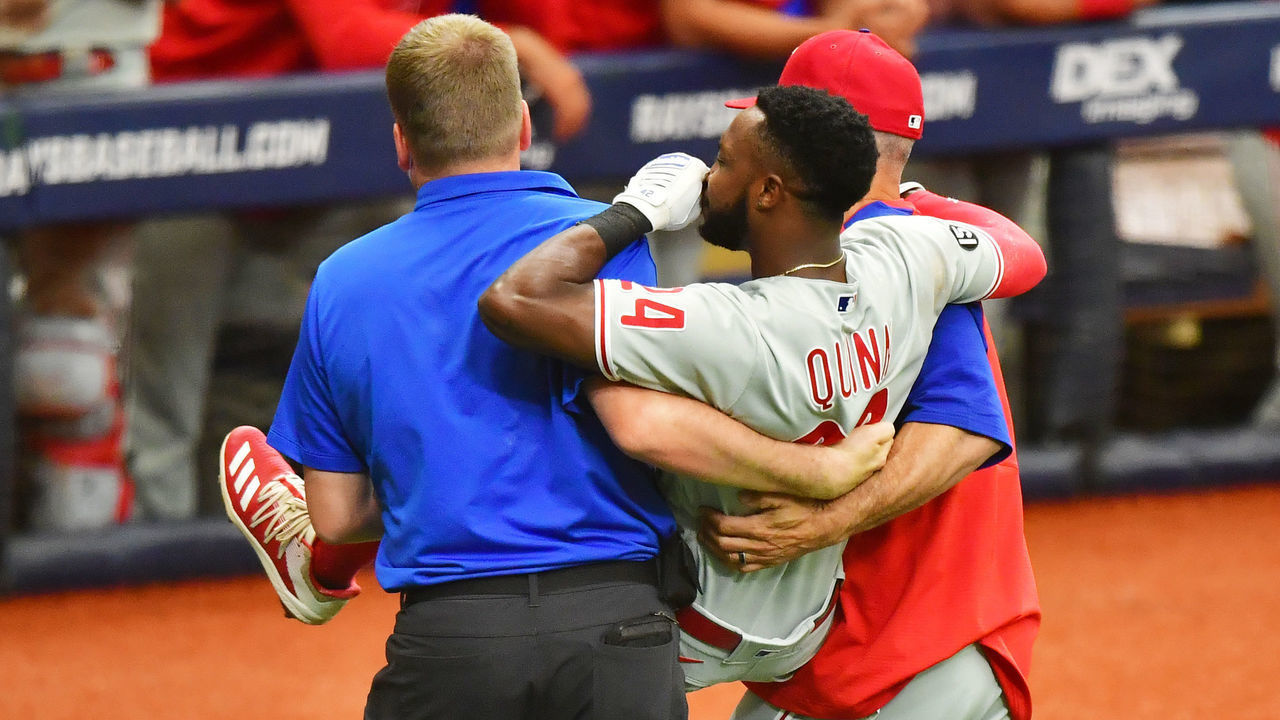 ST PETERSBURG, FLORIDA - MAY 29: Roman Quinn #24 of the Philadelphia Phillies is carried off the field by manager Joe Girardi #25 and a team trainer after an injury in the fifth inning against the Tampa Bay Rays at Tropicana Field on May 29, 2021 in St Petersburg, Florida.