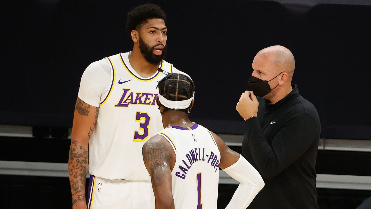 PHOENIX, ARIZONA - MAY 23: Anthony Davis #3 of the Los Angeles Lakers talks with assistant coach Jason Kidd and Kentavious Caldwell-Pope #1 during the second half of Game One of the Western Conference first-round playoff series at Phoenix Suns Arena on May 23, 2021 in Phoenix, Arizona. The Suns defeated the Lakers 99-90.