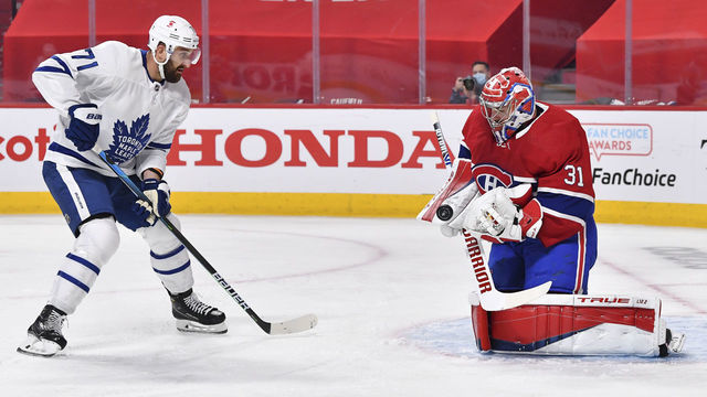 MONTREAL, QC - MAY 29: Goaltender Carey Price #31 of the Montreal Canadiens saves the shot attempt by Nick Foligno #71 of the Toronto Maple Leafs during the first period in Game Six of the First Round of the 2021 Stanley Cup Playoffs at the Bell Centre on May 29, 2021 in Montreal, Canada. The Montreal Canadiens are the first NHL Canadian team to allow a reduced capacity of 2,500 fans inside their venue.