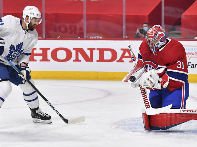 MONTREAL, QC - MAY 29: Goaltender Carey Price #31 of the Montreal Canadiens saves the shot attempt by Nick Foligno #71 of the Toronto Maple Leafs during the first period in Game Six of the First Round of the 2021 Stanley Cup Playoffs at the Bell Centre on May 29, 2021 in Montreal, Canada. The Montreal Canadiens are the first NHL Canadian team to allow a reduced capacity of 2,500 fans inside their venue.