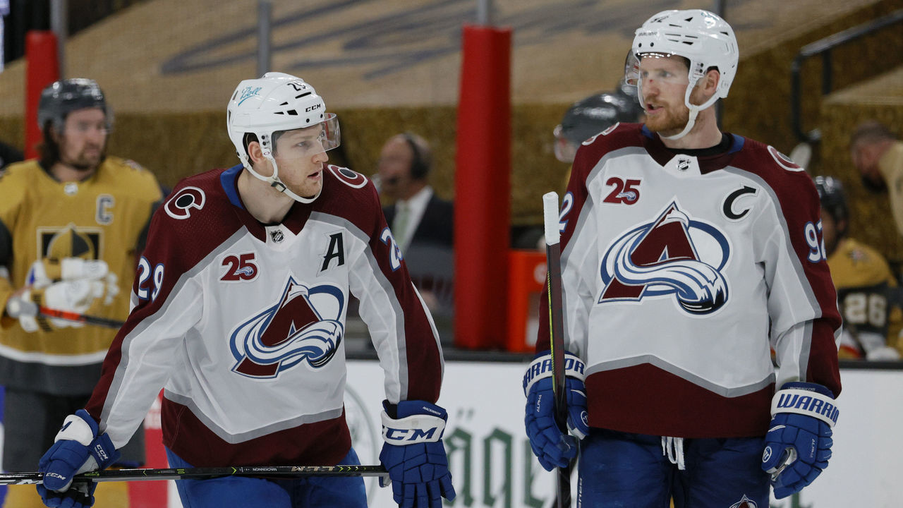LAS VEGAS, NEVADA - APRIL 28: Nathan MacKinnon #29 and Gabriel Landeskog #92 of the Colorado Avalanche talk during a break in the third period of their game against the Vegas Golden Knights at T-Mobile Arena on April 28, 2021 in Las Vegas, Nevada. The Golden Knights defeated the Avalanche 5-2.