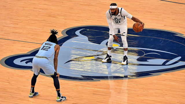 MEMPHIS, TENNESSEE - MAY 29: Mike Conley #10 of the Utah Jazz handles the ball against Ja Morant #12 of the Memphis Grizzlies during the second half in Game Three of the Western Conference playoffs first round series on May 29, 2021 at FedExForum in Memphis, Tennessee.