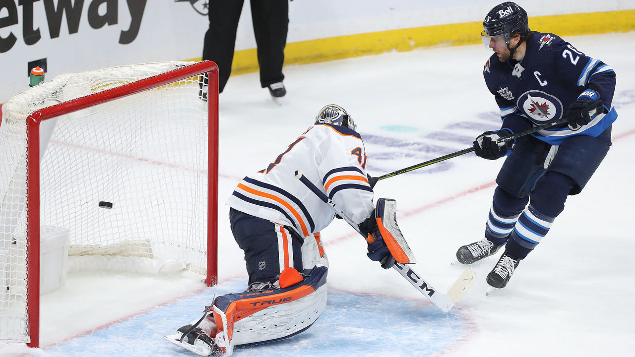 WINNIPEG, MANITOBA - MAY 23: Blake Wheeler #26 of the Winnipeg Jets beats Mike Smith #41 of the Edmonton Oilers for a goal in Game Three of the First Round of the 2021 Stanley Cup Playoffs on May 23, 2021 at Bell MTS Place in Winnipeg, Manitoba, Canada.