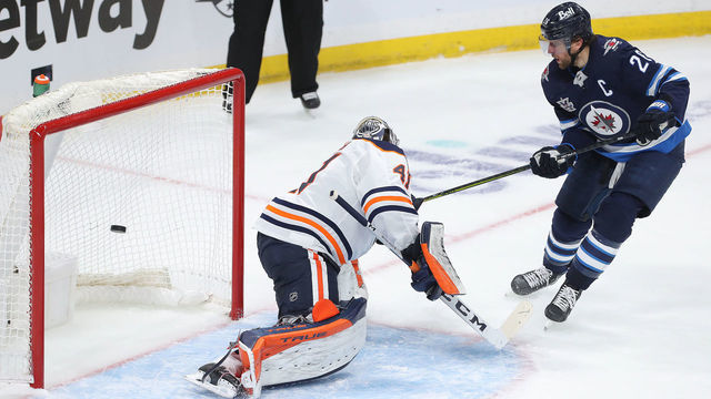 WINNIPEG, MANITOBA - MAY 23: Blake Wheeler #26 of the Winnipeg Jets beats Mike Smith #41 of the Edmonton Oilers for a goal in Game Three of the First Round of the 2021 Stanley Cup Playoffs on May 23, 2021 at Bell MTS Place in Winnipeg, Manitoba, Canada.
