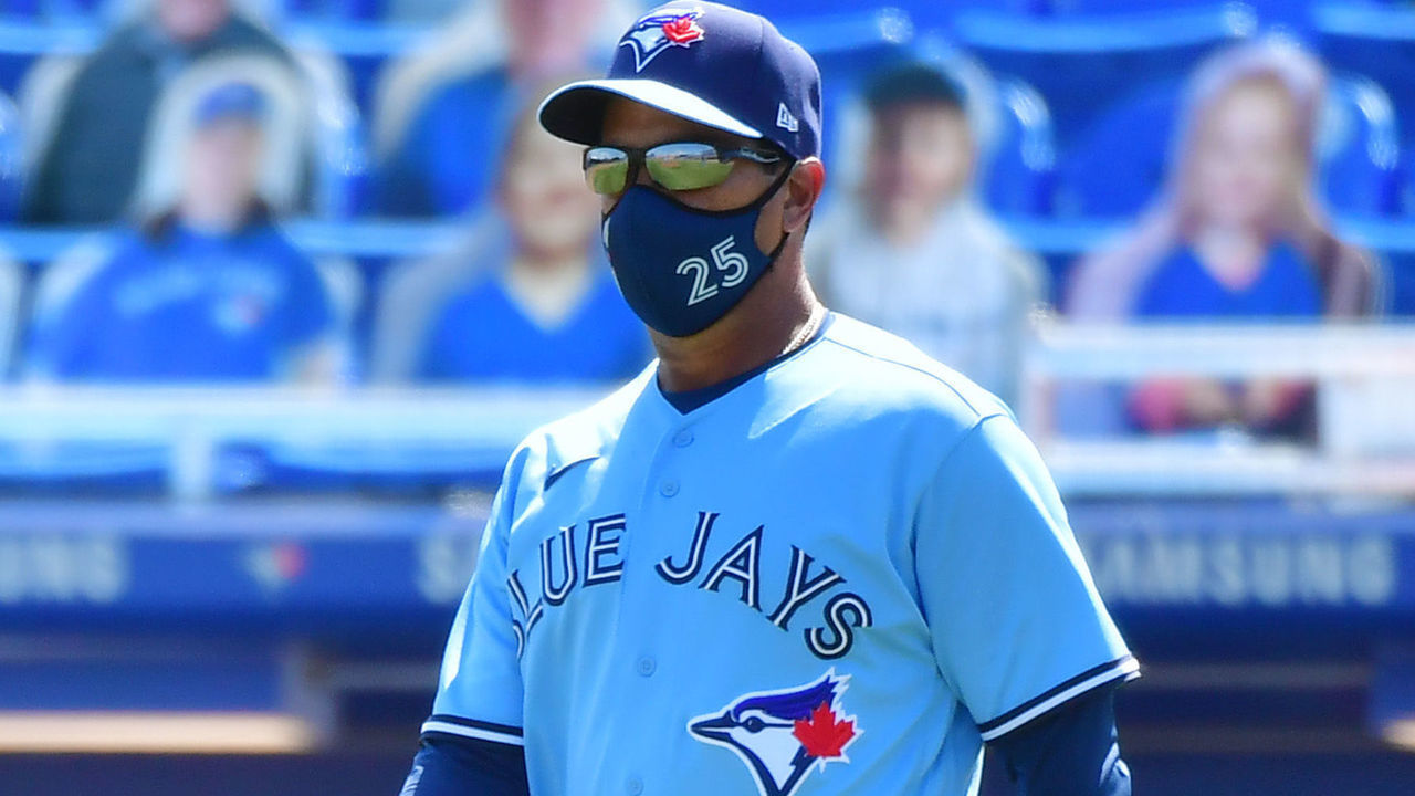 DUNEDIN, FLORIDA - MAY 23: Manager Charlie Montoyo #25 of the Toronto Blue Jays walks out to relieve Tyler Chatwood in the ninth inning against the Tampa Bay Rays at TD Ballpark on May 23, 2021 in Dunedin, Florida.