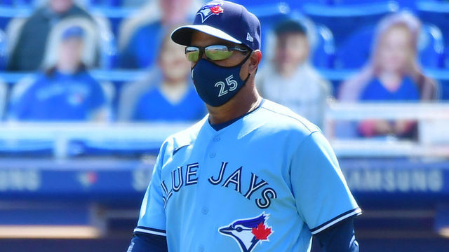 DUNEDIN, FLORIDA - MAY 23: Manager Charlie Montoyo #25 of the Toronto Blue Jays walks out to relieve Tyler Chatwood in the ninth inning against the Tampa Bay Rays at TD Ballpark on May 23, 2021 in Dunedin, Florida.