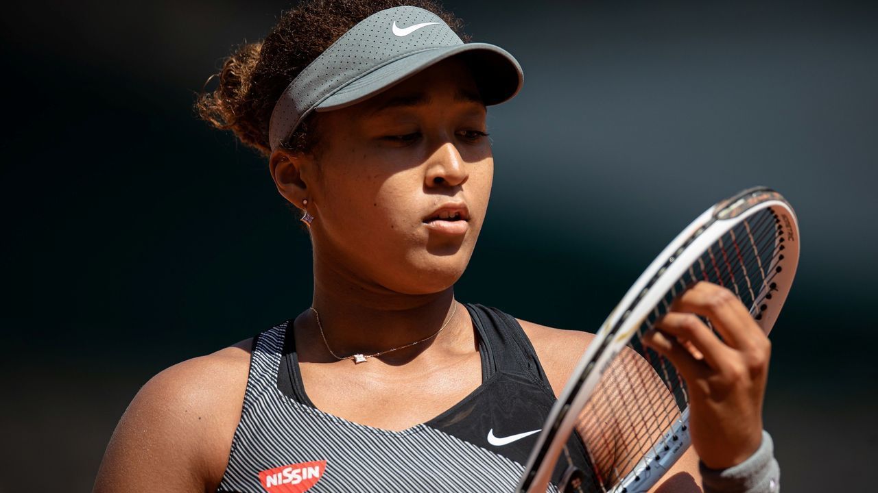 Osaka Naomi of Japan reacts during the women's singles first round match against Patricia Maria Tig of Romania at the French Open tennis tournament at Roland Garros in Paris, France, May 30, 2021.