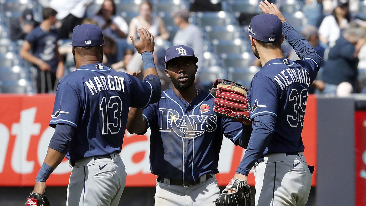 NEW YORK, NEW YORK - MAY 31: Manuel Margot #13, Randy Arozarena #56 and Kevin Kiermaier #39 of the Tampa Bay Rays celebrate after defeating the New York Yankees at Yankee Stadium on May 31, 2021 in New York City.
