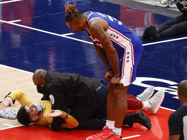 Watch: Fan runs onto court during 76ers-Wizards game | theS…