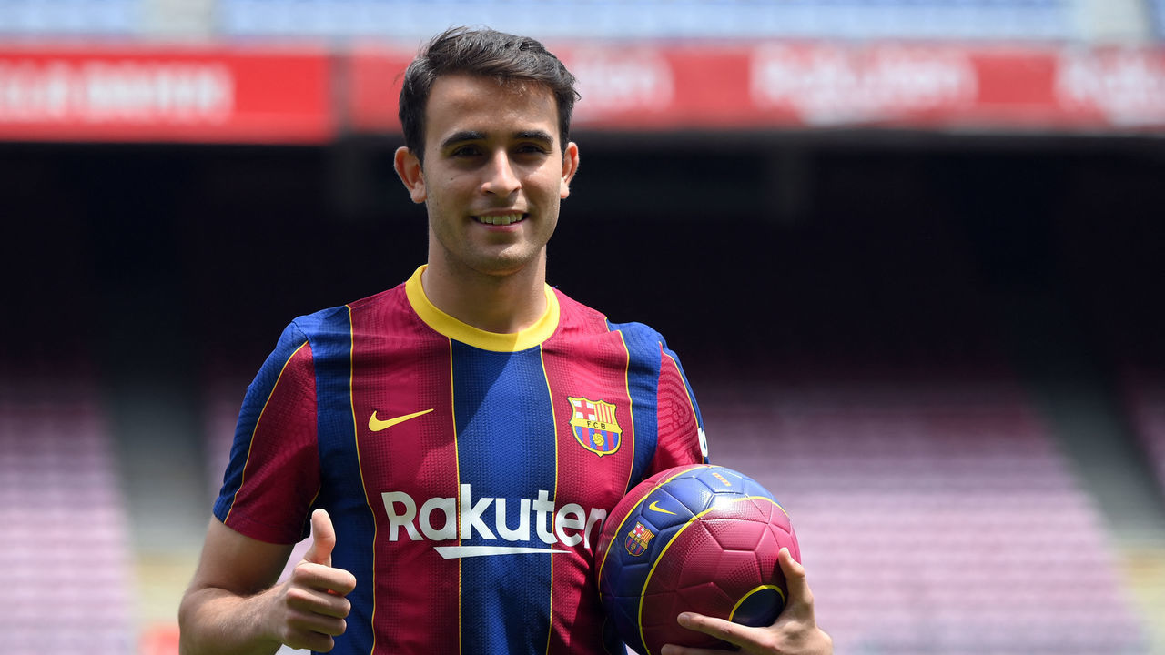 Former Manchester City's player, Spanish defender Eric Garcia poses on the pitch during his official presentation as new player of FC Barcelona at the Camp Nou stadium in Barcelona on June 1, 2021. - Barcelona have signed Spanish defender Eric Garcia on a deal until 2026, the Catalan giants announced today. In a statement, Barca said that Garcia, trained at the club's La Masia football academy, has a buy-out clause "set at 400 million euros ($489,5 million)."