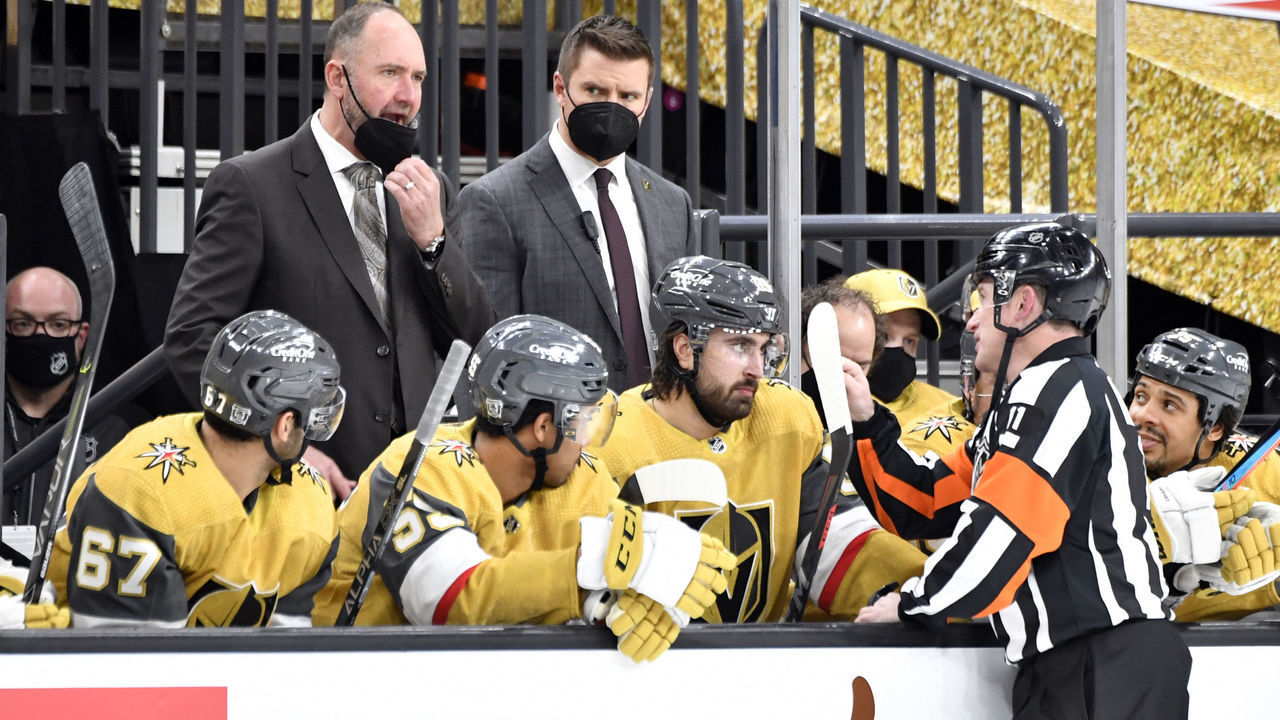 LAS VEGAS, NEVADA - FEBRUARY 14: Vegas Golden Knights head coach Pete DeBoer talks with a referee during the third period of a game against the Colorado Avalanche at T-Mobile Arena on February 14, 2021 in Las Vegas, Nevada.
