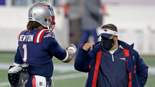 FOXBOROUGH, MA. - DECEMBER 28: Cam Newton #1 of the New England Patriots fist bumps Josh McDaniels before the NFL game against the Buffalo Bills at Gillette Stadium on December 28, 2020 in Foxborough, Massachusetts. (Staff Photo By Matt Stone/ MediaNews Group/Boston Herald)