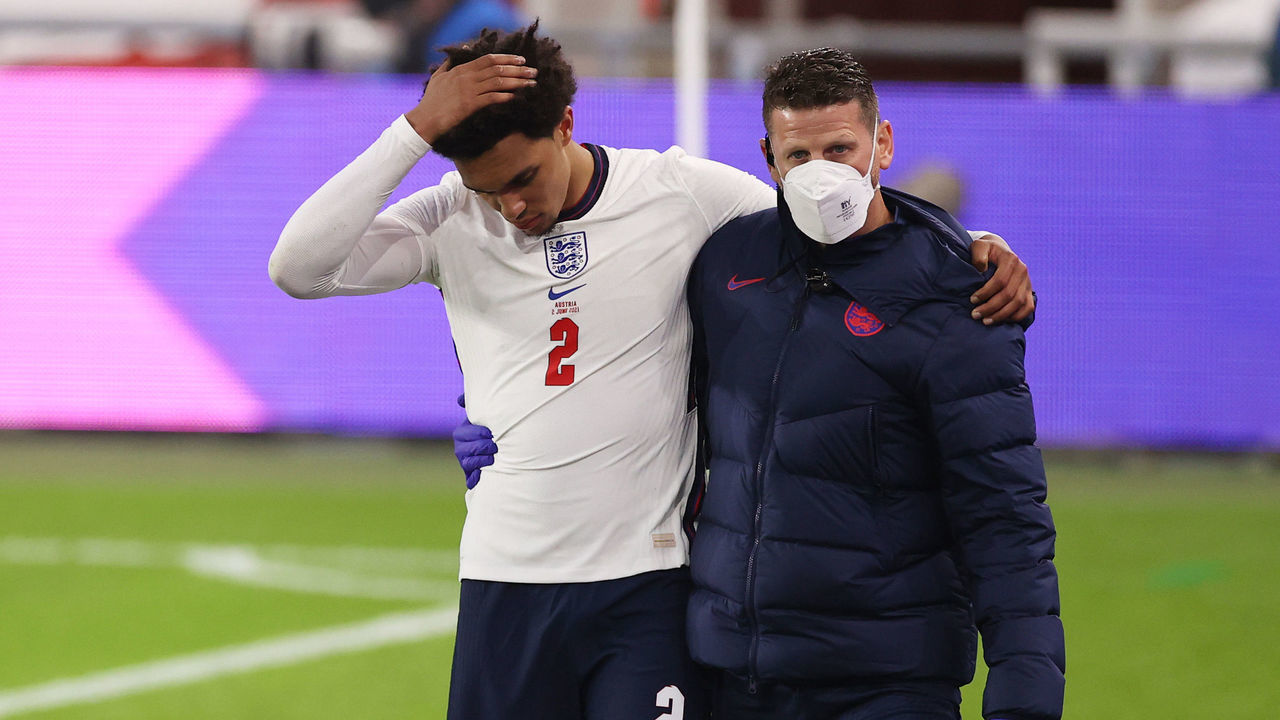 MIDDLESBROUGH, ENGLAND - JUNE 02: Trent Alexander-Arnold of England receives medical attention from England Physio Simon Spencer during the international friendly match between England and Austria at Riverside Stadium on June 02, 2021 in Middlesbrough, England.