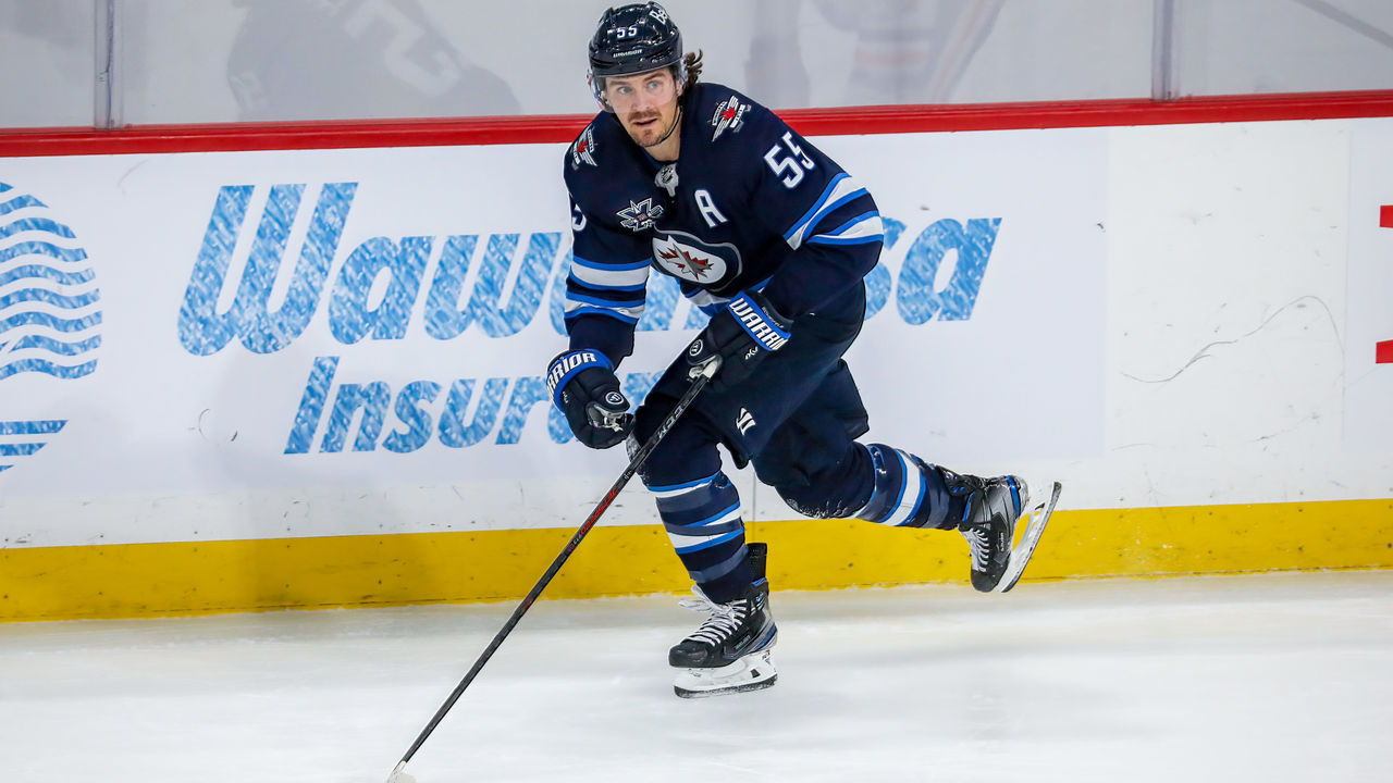 WINNIPEG, MB - MAY 24: Mark Scheifele #55 of the Winnipeg Jets plays the puck during action in the second overtime period against the Edmonton Oilers in Game Four of the First Round of the 2021 Stanley Cup Playoffs at Bell MTS Place on May 24, 2021 in Winnipeg, Manitoba.