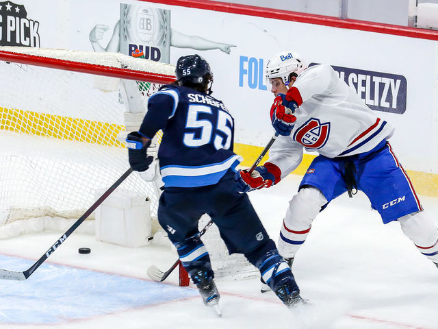 WINNIPEG, MB - JUNE 2: Jake Evans #71 of the Montreal Canadiens scores a third period empty net goal against the Winnipeg Jets in Game One of the Second Round of the 2021 Stanley Cup Playoffs at the Bell MTS Place on June 2, 2021 in Winnipeg, Manitoba, Canada.