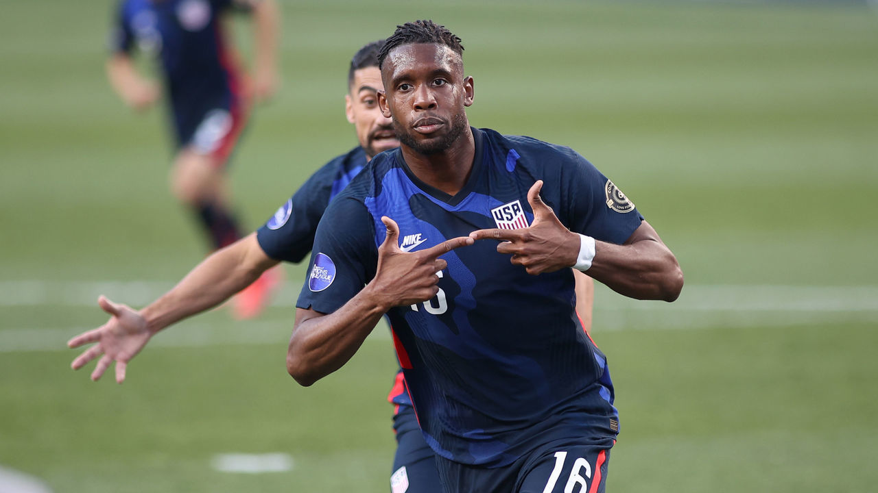 DENVER, CO - JUNE 03: United States forward Jordan Siebatcheu (16) celebrates with teammates after scoring a goal in action during the CONCACAF Nations League semifinal match between the United States and Honduras on June 03, 2021, at Empower Field at Mile High in Denver, CO.