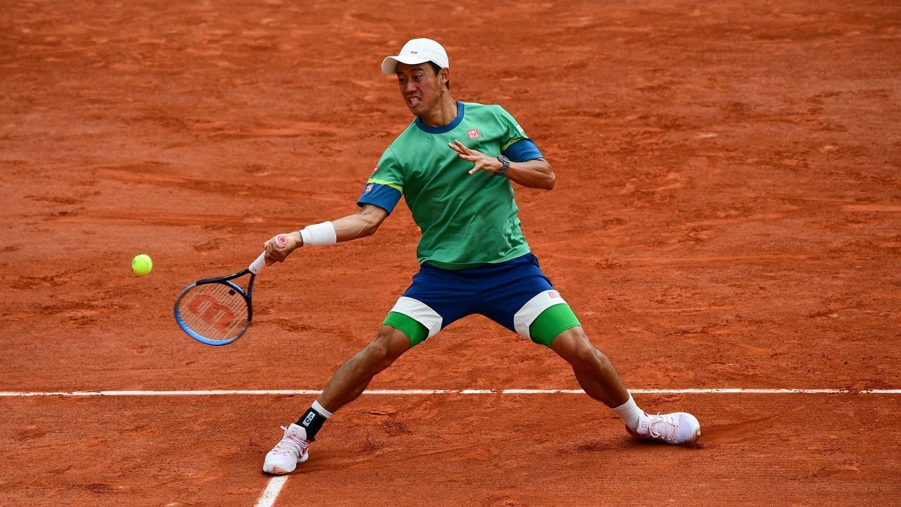 Japan's Kei Nishikori returns the ball to Switzerland's Henri Laaksonen during their men's singles third round tennis match on Day 6 of The Roland Garros 2021 French Open tennis tournament in Paris on June 4, 2021.