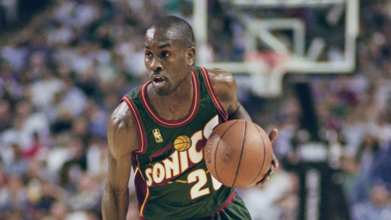 Gary Payton #20, Point Guard for the Seattle SuperSonics dribbles the basketball down court during the NBA Pacific Division basketball game against the Sacramento Kings on 11th November 1996 at the Arco Arena in Sacramento, California, United States. The Seattle SuperSonics won the game 110 - 94.