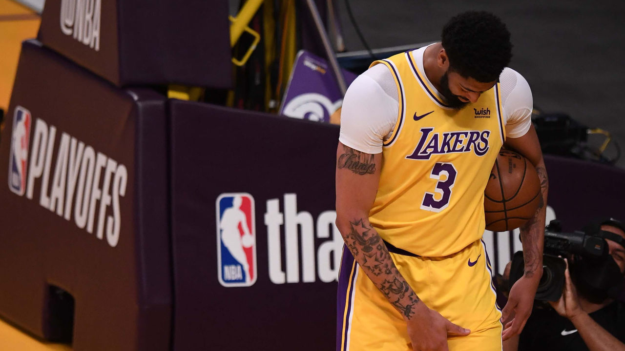 Los Angeles, CA - June 03: Anthony Davis #3 of the Los Angeles Lakers holds his groin muscle after a injury against the Phoenix Suns in the first half of game six of the Western Conference First Round NBA Playoff basketball game at the Staples Center in Los Angeles on Thursday, June 3, 2021.