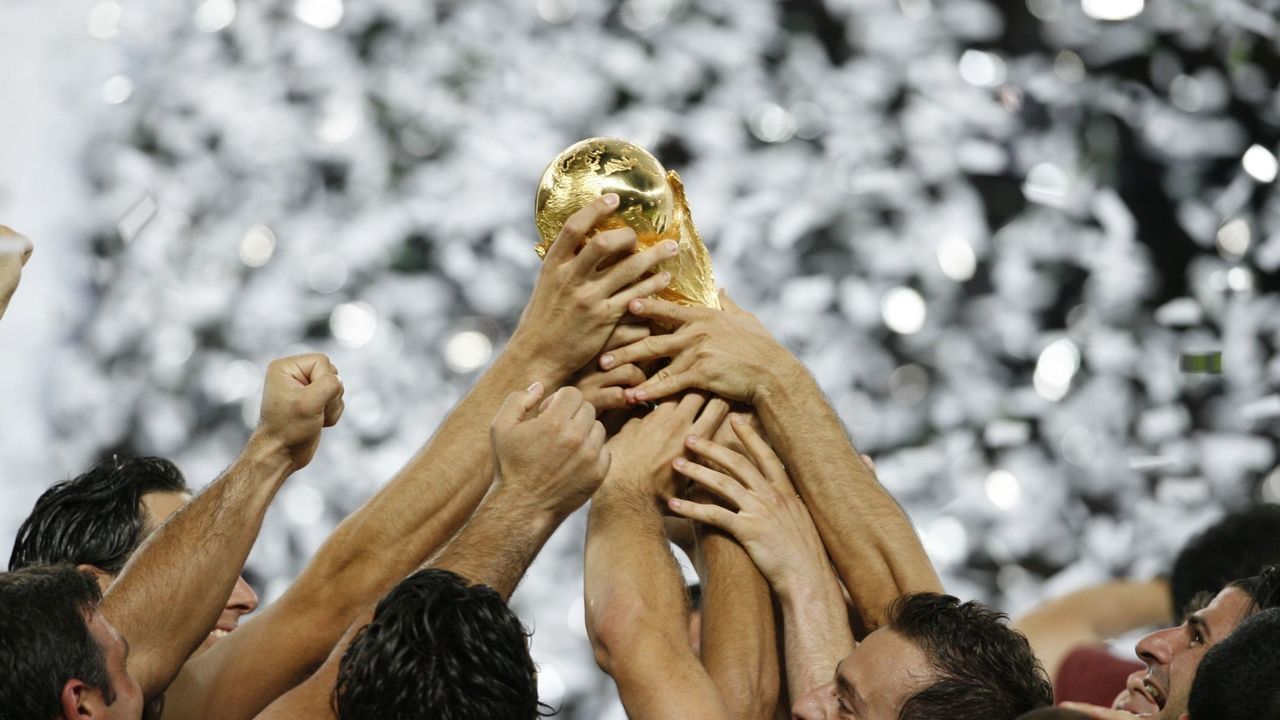 GERMANY - JULY 09: Soccer: World Cup Final, View of hands of Team Italy victorious, holding trophy after winning game vs France, Berlin, Germany 7/9/2006