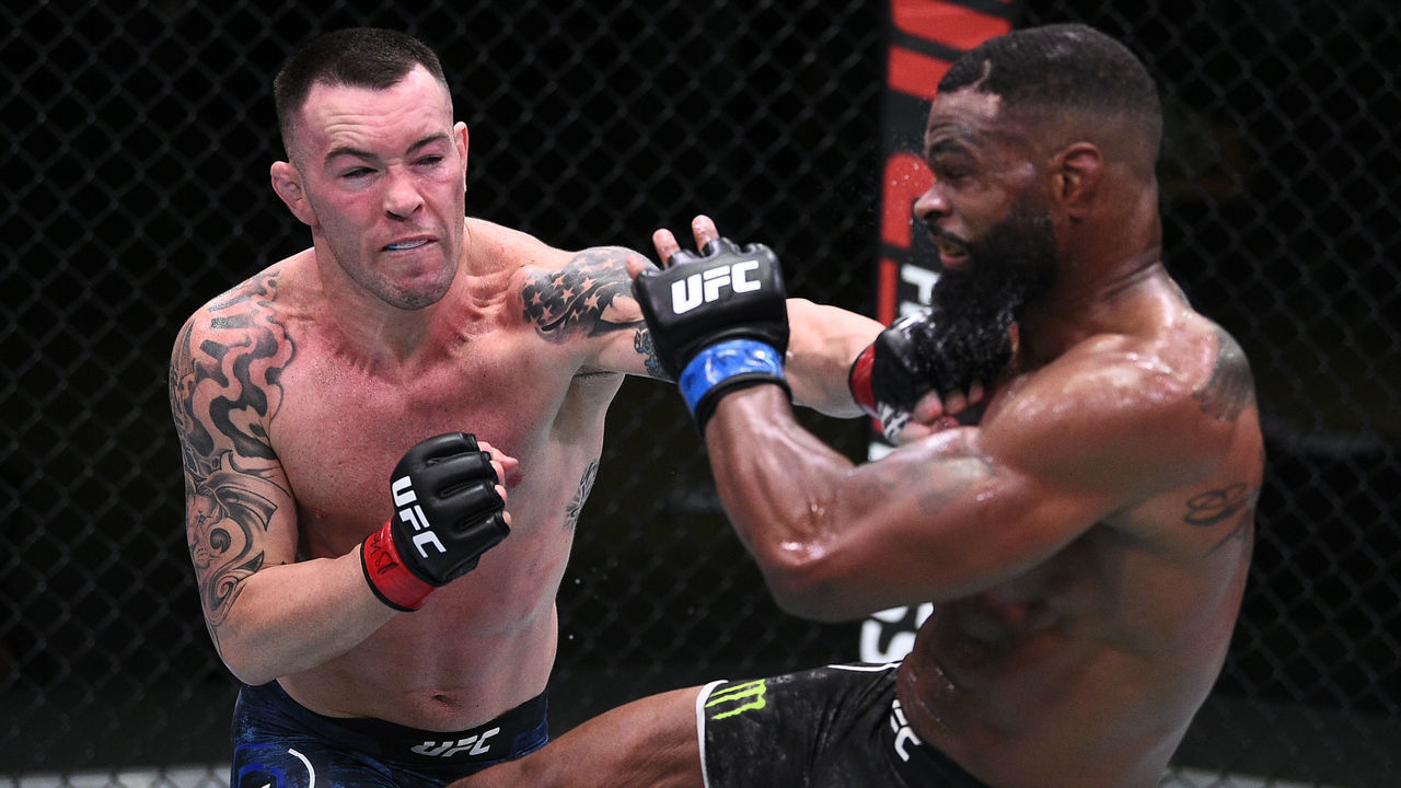 LAS VEGAS, NEVADA - SEPTEMBER 19: (L-R) Colby Covington punches Tyron Woodley in their welterweight bout during the UFC Fight Night event at UFC APEX on September 19, 2020 in Las Vegas, Nevada.