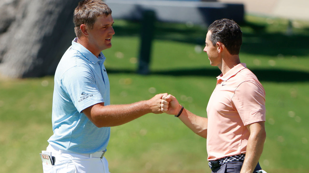 FORT WORTH, TEXAS - JUNE 14: Bryson DeChambeau of the United States and Rory McIlroy of Northern Ireland bump fists after finishing on the 18th green during the final round of the Charles Schwab Challenge on June 14, 2020 at Colonial Country Club in Fort Worth, Texas.