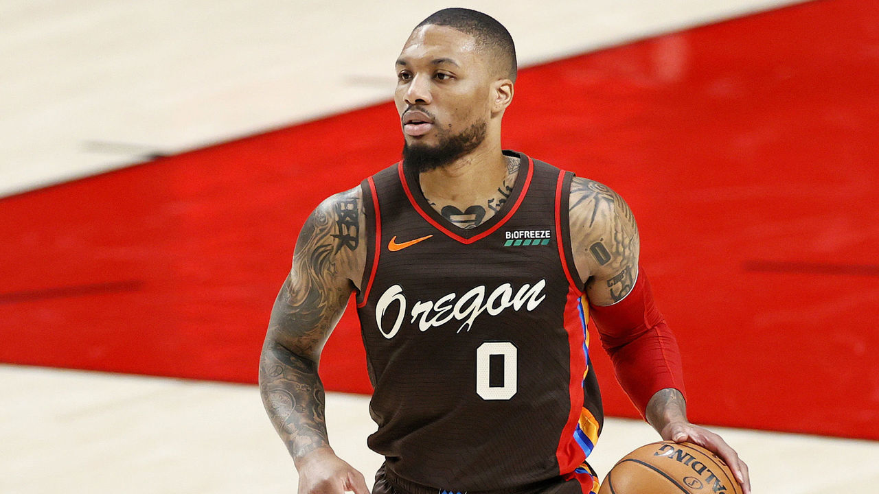 PORTLAND, OREGON - JUNE 03: Damian Lillard #0 of the Portland Trail Blazers dribbles during Round 1, Game 6 of the 2021 NBA Playoffs at Moda Center against the Denver Nuggets on June 03, 2021 in Portland, Oregon.