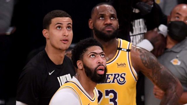 Los Angeles, CA - May 27: Anthony Davis #3 along with teammates Kyle Kuzma #0 looks on and LeBron James #23 look at a replay after teammate Dennis Schroder #17 of the Los Angeles Lakers was fouled by Devin Booker (not pictured) of the Phoenix Suns in the fourth quarter of game three of the Western Conference First Round NBA Playoff basketball game at the Staples Center in Los Angeles on Thursday, May 27, 2021. Booker was ejected from the game.