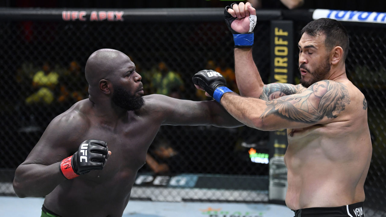 LAS VEGAS, NEVADA - JUNE 05: (L-R) Jairzinho Rozenstruik of Suriname punches Augusto Sakai of Brazil in a heavyweight fight during the UFC Fight Night event at UFC APEX on June 05, 2021 in Las Vegas, Nevada.