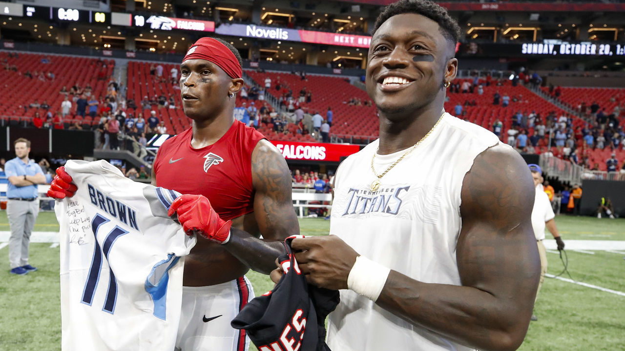 ATLANTA, GA - SEPTEMBER 29: Julio Jones #11 of the Atlanta Falcons swaps jerseys with A.J. Brown #11 of the Tennessee Titans at the conclusion of an NFL game at Mercedes-Benz Stadium on September 29, 2019 in Atlanta, Georgia.