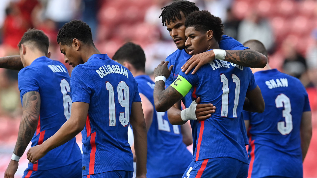 England's striker Marcus Rashford (2R) celebrates scoring his team's first goal with England's defender Tyrone Mings (3R) during the international friendly football match between England and Romania at the Riverside Stadium in Middlesbrough, north-east England on June 6, 2021. - - NOT FOR MARKETING OR ADVERTISING USE / RESTRICTED TO EDITORIAL USE