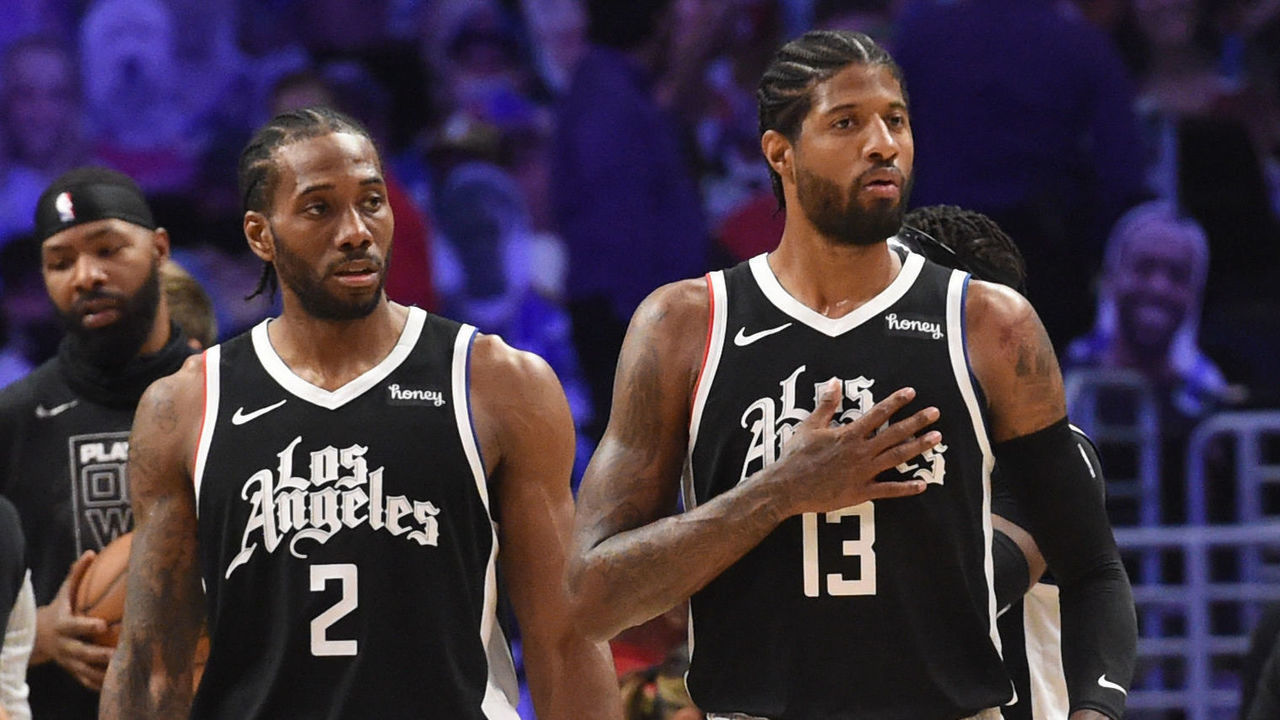LOS ANGELES, CA - JUNE 6: Kawhi Leonard #2 of the LA Clippers and Paul George #13 of the LA Clippers look on during Round 1, Game 7 of the 2021 NBA Playoffs on June 6, 2021 at STAPLES Center in Los Angeles, California. NOTE TO USER: User expressly acknowledges and agrees that, by downloading and/or using this Photograph, user is consenting to the terms and conditions of the Getty Images License Agreement. Mandatory Copyright Notice: Copyright 2021 NBAE