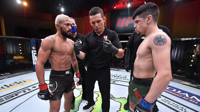 LAS VEGAS, NEVADA - DECEMBER 12: (L-R) Deiveson Figueiredo of Brazil and Brandon Moreno of Mexico face off prior to their flyweight championship bout during the UFC 256 event at UFC APEX on December 12, 2020 in Las Vegas, Nevada.