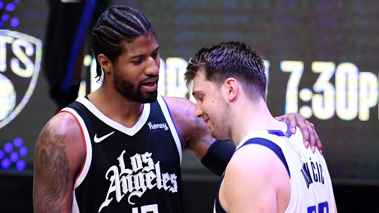 Los Angeles, CA - June 06: Paul George #13 of the LA Clippers consoles Luka Doncic #77 of the Dallas Mavericks after defeating the Dallas Mavericks 126-111 during game seven of the Western Conference First Round NBA Playoff basketball game at the Staples Center in Los Angeles on Sunday, June 6, 2021. LA Clippers won 126-111 to advance to the second round.