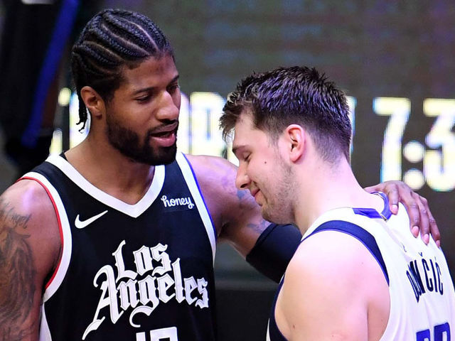 Los Angeles, CA - June 06: Paul George #13 of the LA Clippers consoles Luka Doncic #77 of the Dallas Mavericks after defeating the Dallas Mavericks 126-111 during game seven of the Western Conference First Round NBA Playoff basketball game at the Staples Center in Los Angeles on Sunday, June 6, 2021. LA Clippers won 126-111 to advance to the second round.