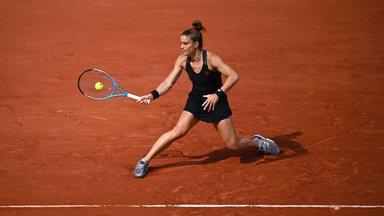 Greece's Maria Sakkari returns the ball to Sofia Kenin of the US during their women's singles fourth round tennis match on Day 9 of The Roland Garros 2021 French Open tennis tournament in Paris on June 7, 2021.