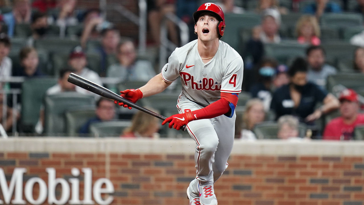 ATLANTA, GA - MAY 08: Philadelphia Phillies Infielder Scott Kingery (4) bunts during the Saturday night MLB game between the Atlanta Braves and the Philadelphia Phillies on May 8, 2021 at Truist Park in Atlanta, Georgia.