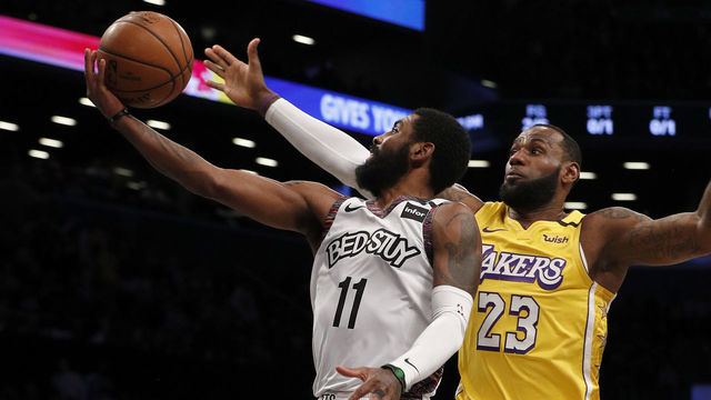 NEW YORK, NEW YORK - JANUARY 23: (NEW YORK DAILIES OUT) Kyrie Irving #11 of the Brooklyn Nets in action against LeBron James #23 of the Los Angeles Lakers at Barclays Center on January 23, 2020 in New York City. The Lakers defeated the Nets 128-113.