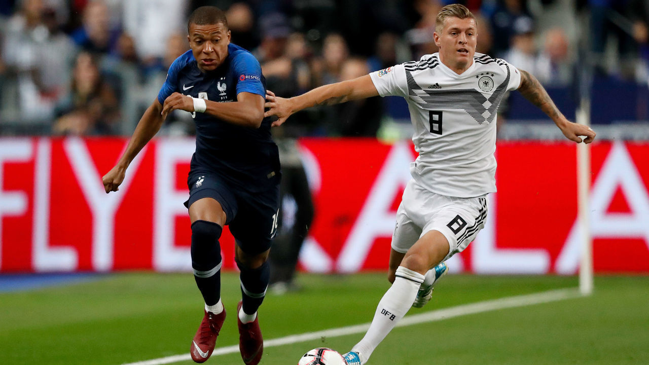 PARIS, FRANCE - OCTOBER 16: (L-R) Kylian Mbappe of France, Toni Kroos of Germany during the UEFA Nations league match between France v Germany at the Stade de France on October 16, 2018 in Paris France