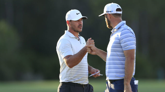 BRADENTON, FLORIDA - FEBRUARY 26: (L-R) Brooks Koepka of the United States and Dustin Johnson of the United States fist bump on the 18th green during the second round of World Golf Championships-Workday Championship at The Concession on February 26, 2021 in Bradenton, Florida.