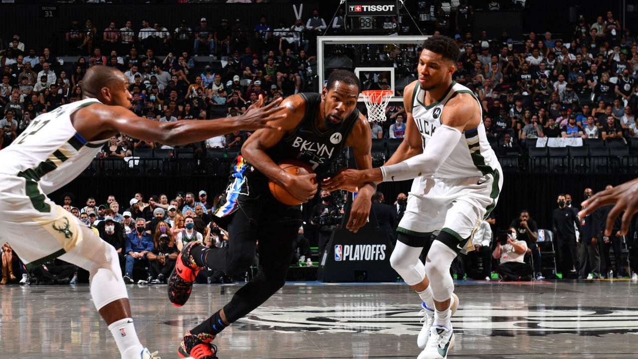 BROOKLYN, NY - JUNE 7: Kevin Durant #7 of the Brooklyn Nets drives to the basket against Giannis Antetokounmpo #34 of the Milwaukee Bucks during Round 2, Game 2 on June 7, 2021 at Barclays Center in Brooklyn, New York. NOTE TO USER: User expressly acknowledges and agrees that, by downloading and/or using this Photograph, user is consenting to the terms and conditions of the Getty Images License Agreement. Mandatory Copyright Notice: Copyright 2021 NBAE